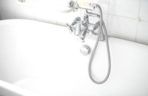 a shower in a bathroom with a tub at The Bay View Inn in Bude