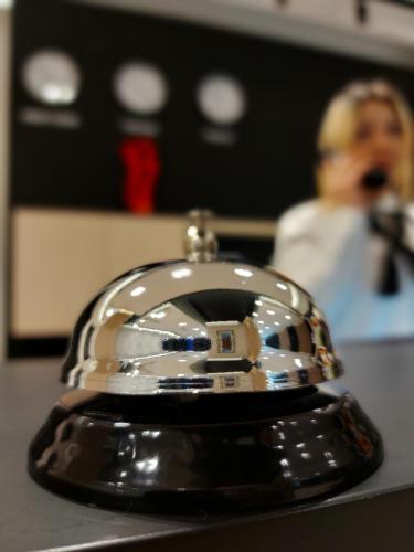 a close up of a silver object on a table at Mulaj Hotel in Tirana