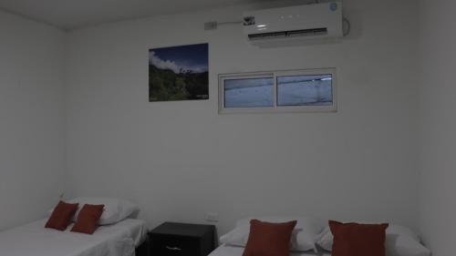 Postel nebo postele na pokoji v ubytování Puerto Caribe Hostal