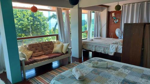 Katil atau katil-katil dalam bilik di Pousada casas nas arvores
