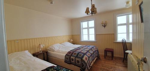 Postel nebo postele na pokoji v ubytování Saudafell Guesthouse