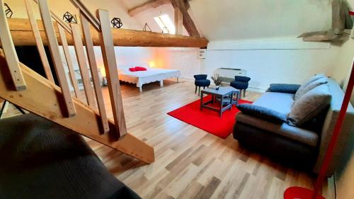 a living room with a couch and a table at Gite Evidence in Varennes-sur-le-Doubs