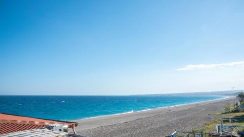 a view of a beach with the ocean at Ahm7nani in Mascali