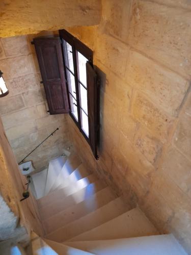 an overhead view of a stairs with a window at 3Cities Maison close to Valletta in Cospicua