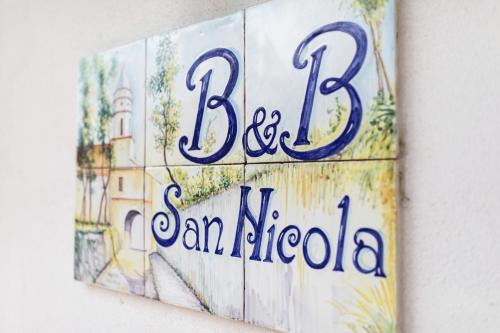 a sign on a wall with the words baja cantida at San Nicola in Agerola