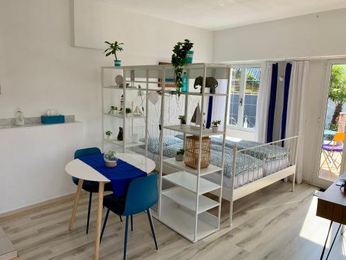a room with a bed and a table and chairs at Casa Belvedere in Rovio