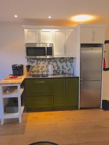 Una cocina o zona de cocina en Condo Hôtel Magog Orford