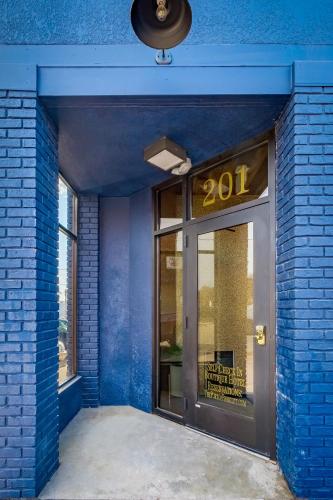 an entrance to a blue brick building with a door at The Port of Prescott Boutique Hotel in Prescott