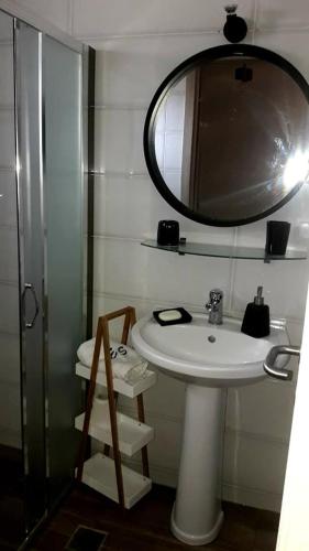 a bathroom with a sink and a mirror at Elli S onar in Sykia Chalkidikis
