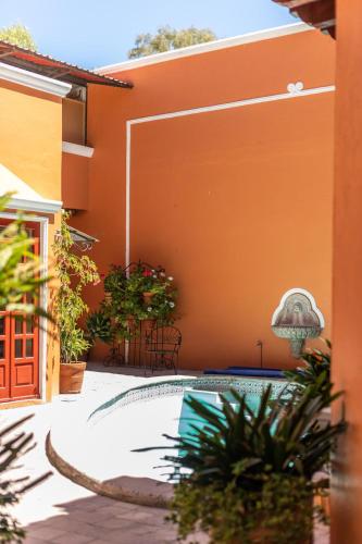 a courtyard with a pool in a house at Casa De La O in San Miguel de Allende