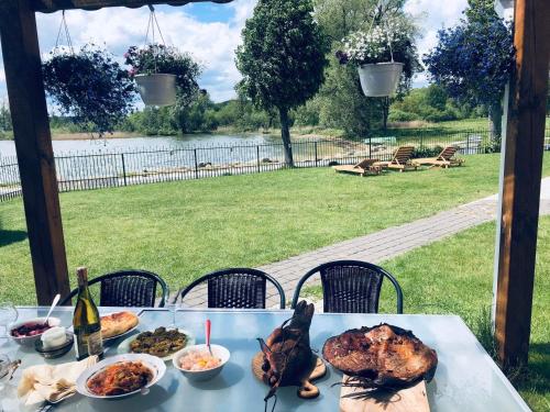 a table with a turkey and other food on it at Villa in Vistytis in Vištytis