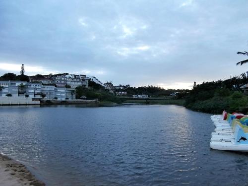 a river with a row of boats in the water at The Courthouse in Ramsgate
