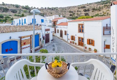 a view from a balcony of a town with white buildings at Antonis G. Hotel Apartments in Voroklini