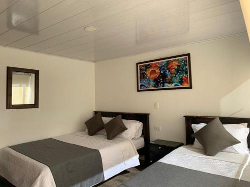 Postel nebo postele na pokoji v ubytování Hotel Santa Elena Norte