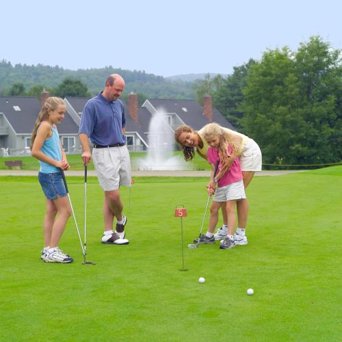 a group of people playing a game of golf at Stoweflake Mountain Resort & Spa in Stowe