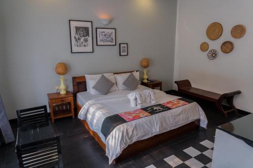 A bed or beds in a room at Baby Elephant Boutique Hotel
