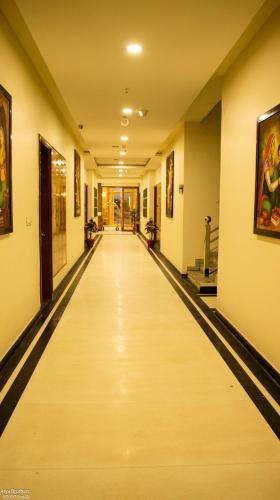 a long hallway of a building with a long aisle at The Grand Shekhawati in Rāmsir
