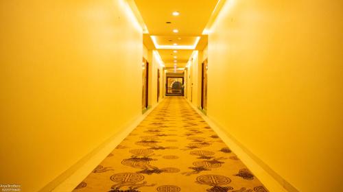 a hallway with a tile floor in a building at The Grand Shekhawati in Rāmsir