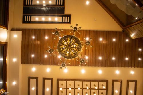 a chandelier hanging from the ceiling in a room at The Grand Shekhawati in Rāmsir