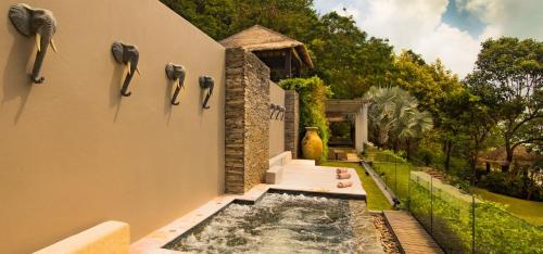 a house with a swimming pool in the yard at Sangsuri Villa 1 in Choeng Mon Beach