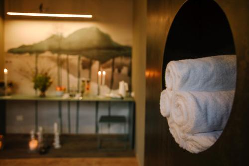a close up of a bathroom with towels at Langhe Country House in Neive