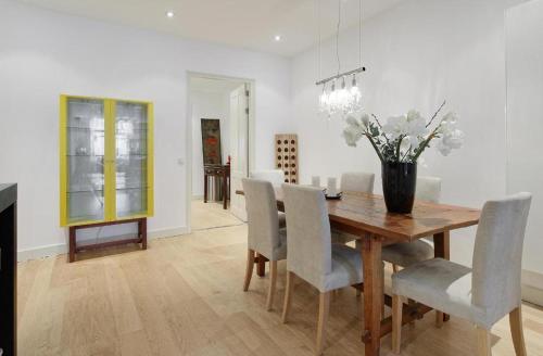 a dining room with a wooden table and chairs at Luxury Prinsengracht Canal House Jordan Area in Amsterdam