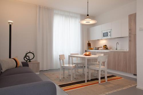 a kitchen with a table and chairs in a room at Residenza Dante in Nuoro