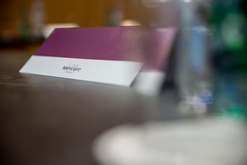a purple and white box sitting on top of a table at Mercure Dinan Port Le Jerzual in Dinan