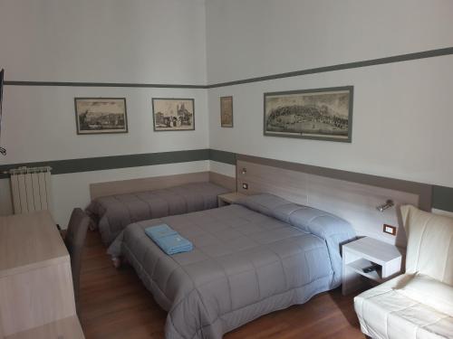 Tempat tidur dalam kamar di Albergo Astro