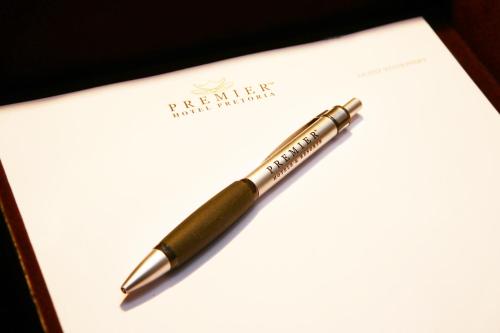 a fountain pen sitting on top of a piece of paper at Premier Express Inn George in George