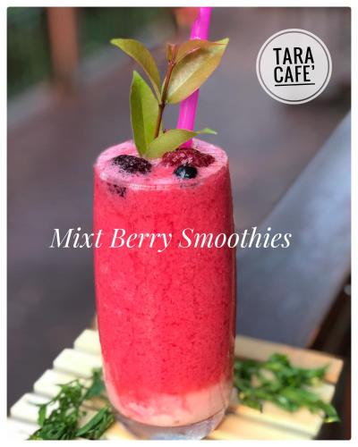 a pink drink with a plant sticking out of it at Papai Country Lodge SHA in Ban Mae Pong