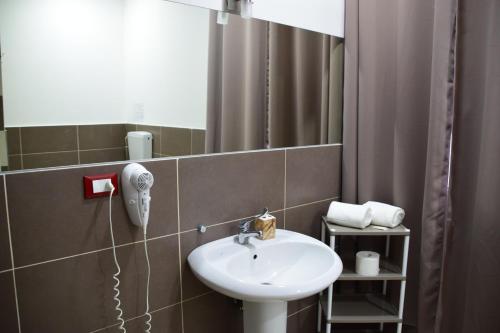 a bathroom with a sink and a mirror at Mg Palace Hotel Costa del Sole in Vaccarizzo - Delfino