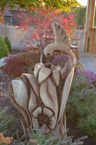 a statue of a person in a garden at Lied Lodge at Arbor Day Farm in Nebraska City