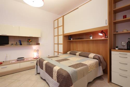 Postel nebo postele na pokoji v ubytování Accogliente Appartamento vicino al Centro Storico con Posto Auto