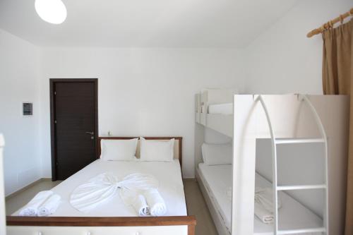 Postel nebo postele na pokoji v ubytování Villa Kristjana Ksamil