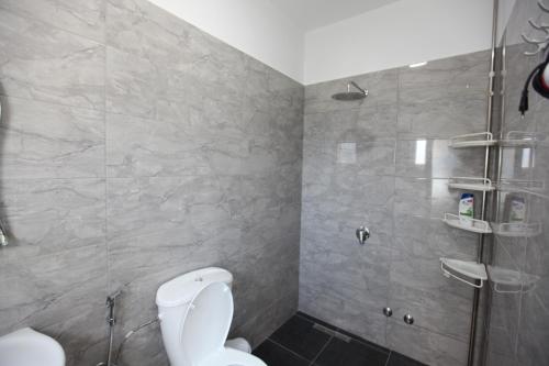 a bathroom with a toilet and a shower at Villa Kristjana Ksamil in Ksamil