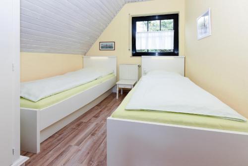 Postel nebo postele na pokoji v ubytování Ferienhaus Lüder