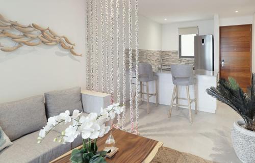 a living room with a couch and a table at AQUA Boutique Hotel in Glacis