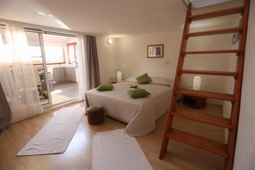 En eller flere senger på et rom på Villa Ombre