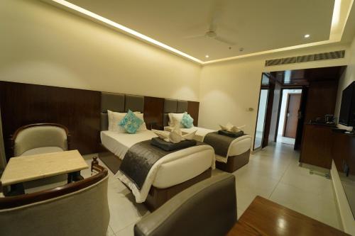 Cama o camas de una habitación en Kyriad Vajram Guntur