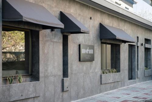 a building with windows and a sign on it at Morum City Hotel Chania in Chania Town
