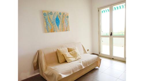 A bed or beds in a room at Trilocale La Praja Gallipolitravel