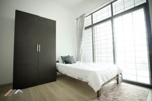 Katil atau katil-katil dalam bilik di Curtin Waters Homestay by Evernent