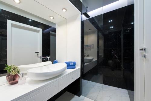 Ванная комната в AURA Gdansk by Q4Apartments