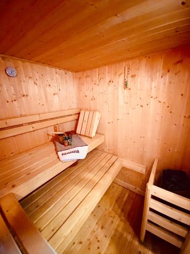 an inside view of a wooden sauna with a box at Zirbitz Hütte mit Sauna und Kamin in Sankt Lambrecht