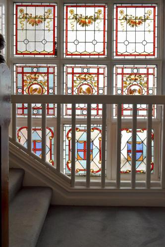 a window with a bunch of stained glass at The Hotel Commodore in Llandrindod Wells