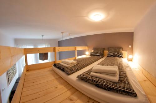 a room with two beds in a room with at Kasia&Lukasz Apartments in Krakow