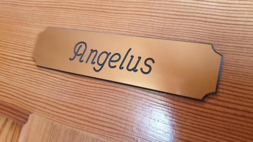 a sign that says argus on a wooden wall at Le Prangeleux in Tenneville