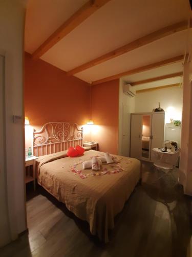 Il Mare Di Roma Luxury tesisinde bir odada yatak veya yataklar