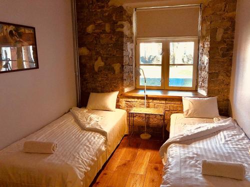 Postel nebo postele na pokoji v ubytování Kohtu Apartment Unique